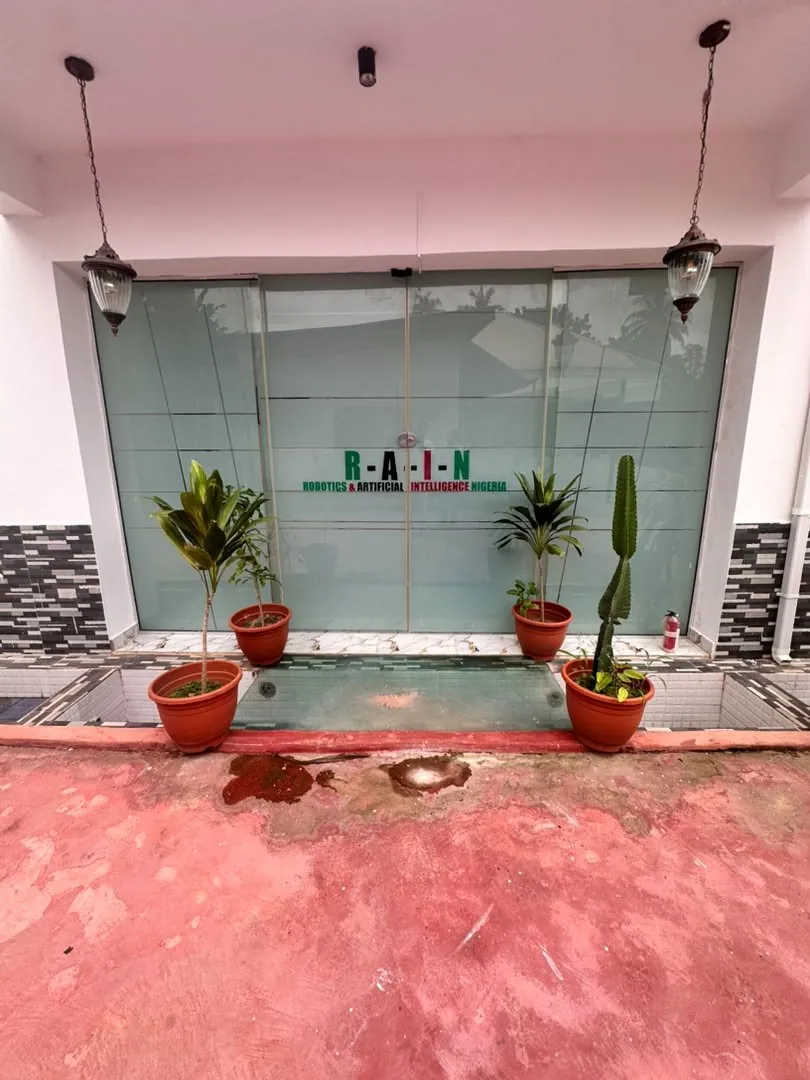 The glass entrance with the RAIN logo