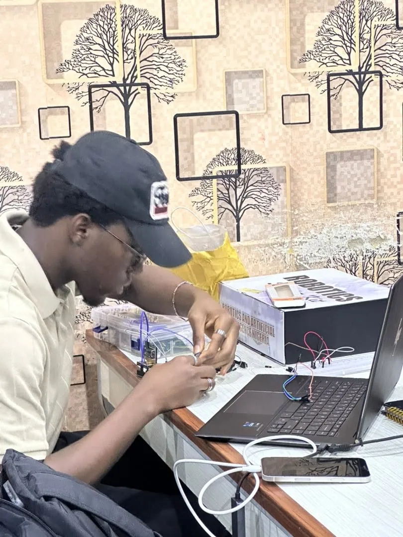A trainee working on a circuit