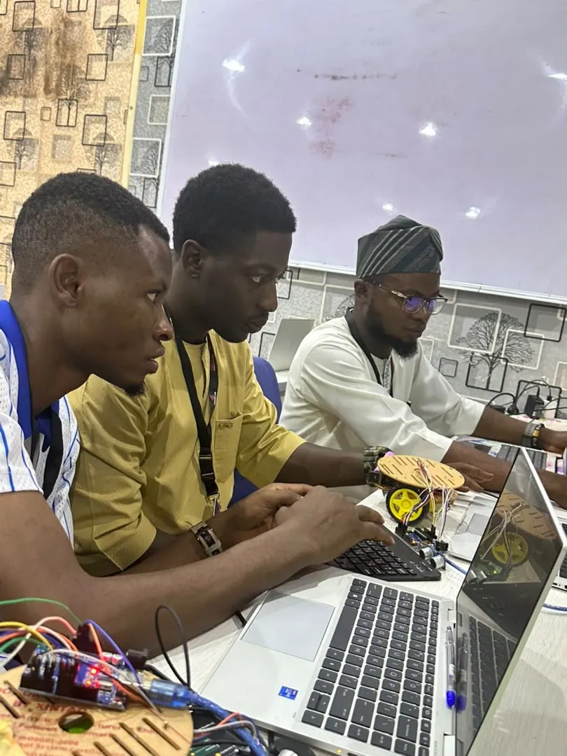 Trainees building electronics